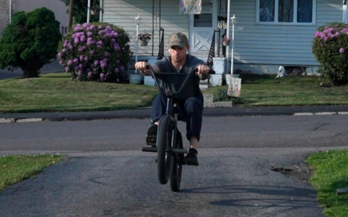 Billy Kennedy demonstrating a manual on a BMX Bike