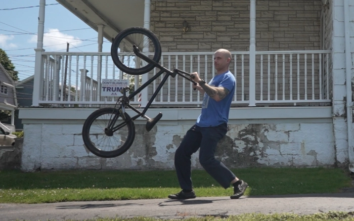 Billy Kennedy Looping out a manual on a BMX bike