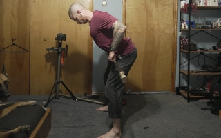 Billy Kennedy performing a row with a hockey stick to illustrate the relationship between rowing and the pull-phase in a bunnyhop.