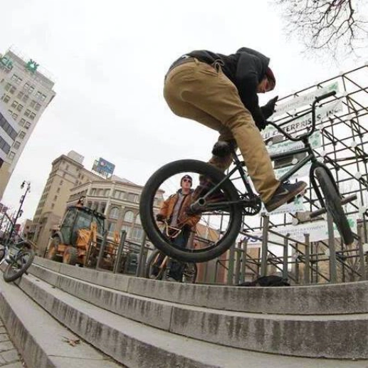 Billy Kennedy doing a barspin up a four set stair in Wilkes-Barre, Pennsylvania.